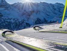 Skiers pose on the slope in Mürren-Schilthorn. The trio of mountains—the Eiger, Mönch, and Jungfrau—can be seen in the distance.