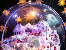 The giant snow globe in the Ice Palace on the Jungfrau Joch, surrounded by glowing stars.